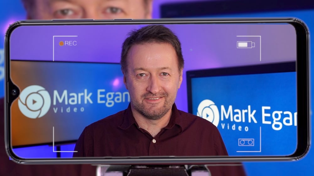 Mark Egan headshot on smartphone