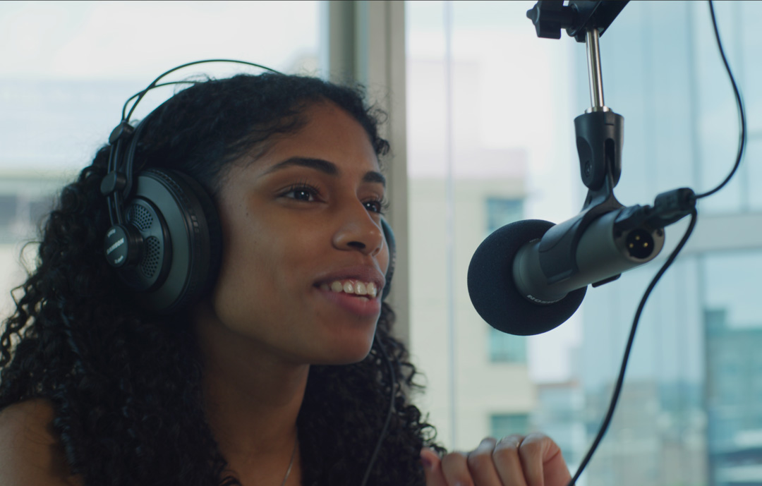 Woman speaking into Q2U microphone